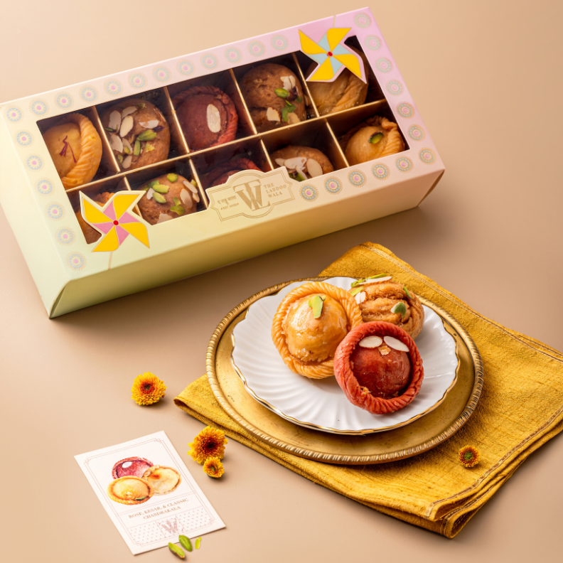 Jogira Holi gift box featuring traditional chandrakala and balushahi sweets